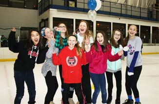 Group of girls at Rocket Ice Skating Rink for a birthday party.