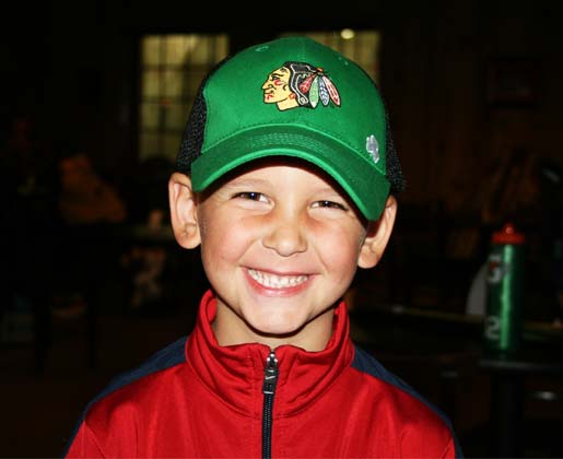 Blackhawks fan waiting in lobby before ice hockey. Rocket Ice skating rink