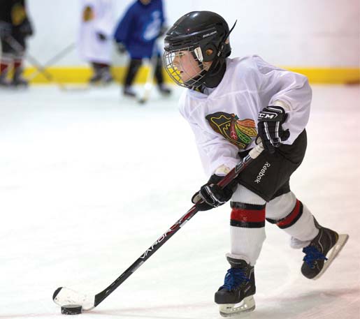 Hockey Player wearing a blakhwaks jersey practices at hockey lessons