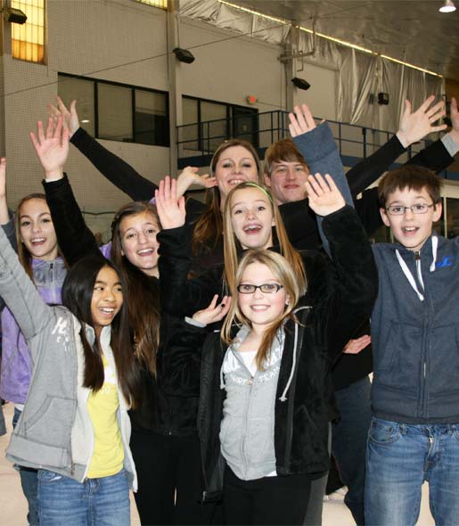 A group ice skating outing is having lots of fun ice skating