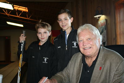 Bobby Hull with 2 hockey players