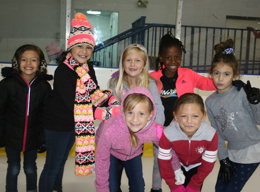 Rocket Ice provides ice skating near Plainfield, girls having fund ice skating.