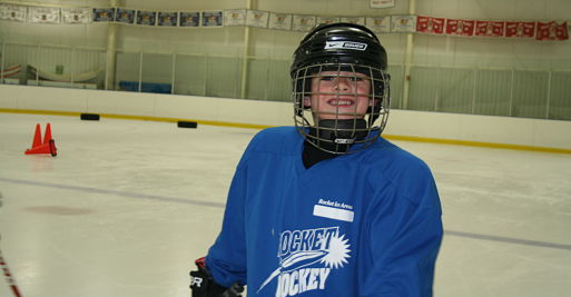 Ice skating rink near Lemont, Rocket Ice - boy playing hockey.