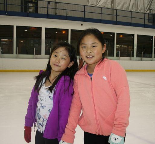 Ice skating rink near Lemont , Rocket Ice - girls ice skating.