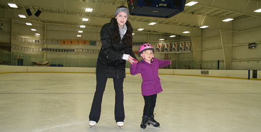 Ice skating rink near Lemont, Rocket Ice - mom and daughter skating.
