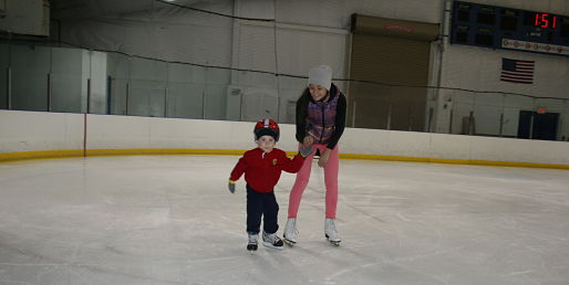 Ice skating rink near Lockport, Rocket Ice - young boy ice skating.