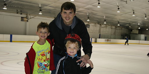 Ice skating rink near Naperville - dad and kids.