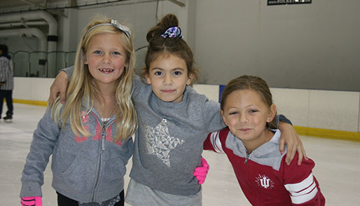 Ice skating rink near Woodridge - girls ice skating at Rocket Ice.