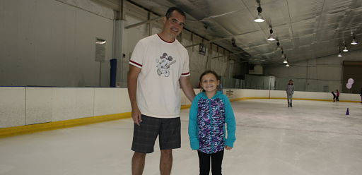 Ice skating rink near Downers Grove - dad and daughter ice skating.