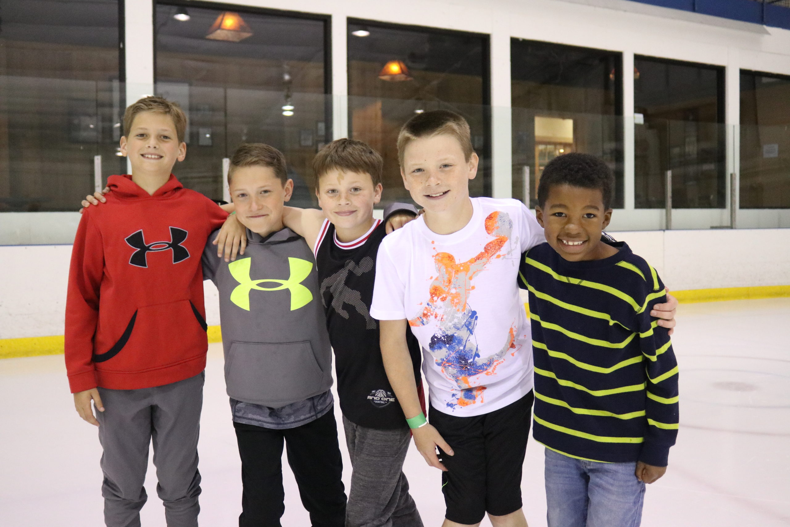 A group celebrating a boy's birthday by ice skating at Rocket Ice