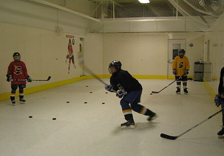 Students training on synthetic ice.